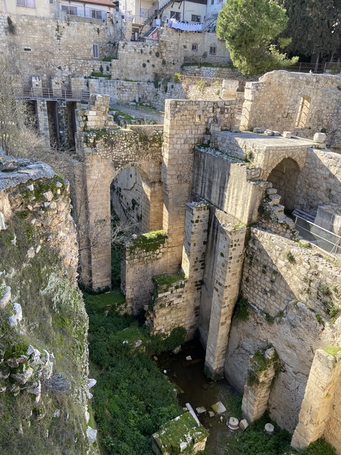 Ancient stone ruins with arches.