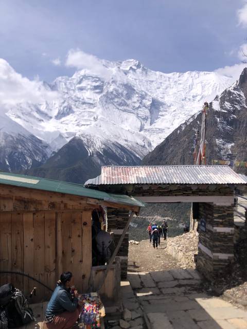 Mountainous village with snow-covered peaks.