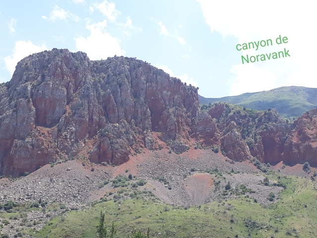 Rocky canyon landscape under a blue sky.