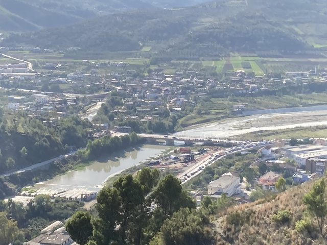 Aerial view of a town with a winding river.