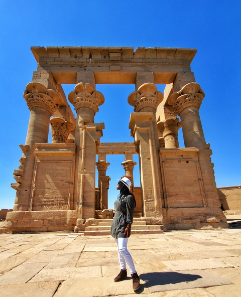 Woman admiring ancient columns.