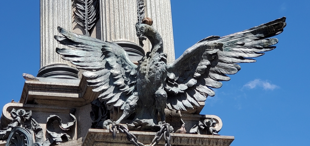 Close-up of an eagle sculpture on a monument.