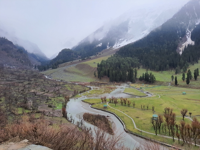 Scenic view of a valley with a river winding through it.