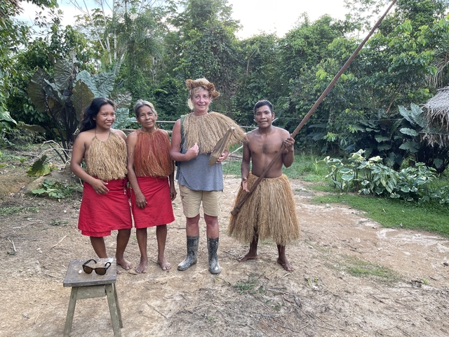 Group of people in traditional clothing smiling.