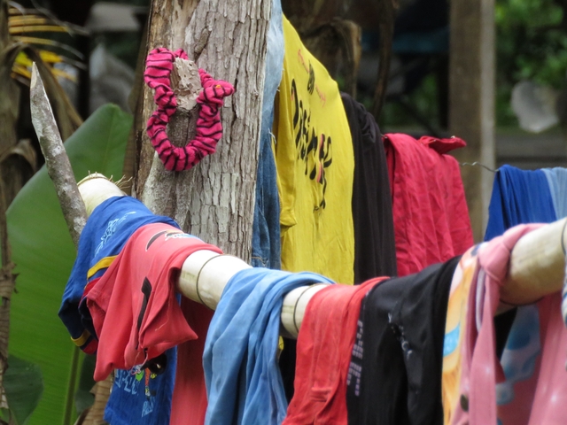 Clothes hanging on a line outside.