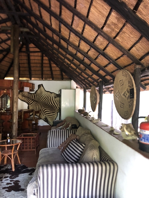 Interior of a lodge with African decor.