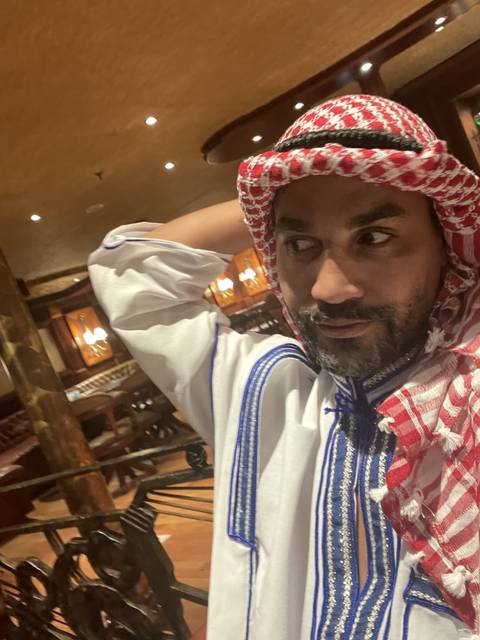 Person in traditional attire indoors.