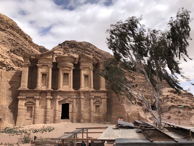 The Monastery, an ancient stone structure with a tree beside it.