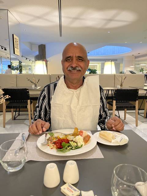 Person enjoying a meal at a restaurant.
