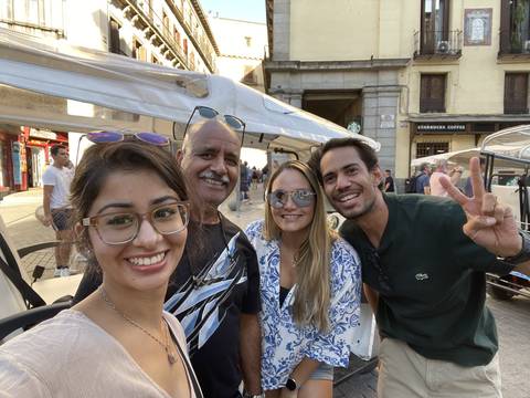Group photo of four people smiling.