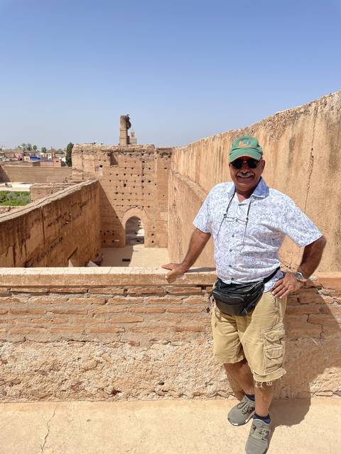 Person posing on ancient ruins.
