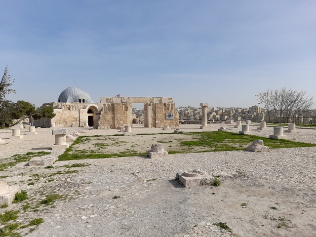 Remains of a Roman citadel with city in the background.