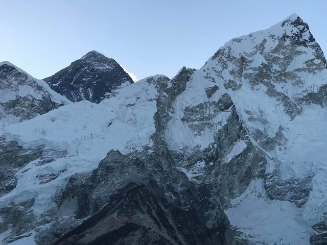 Close-up view of snow-clad Himalayan peaks and glaciers including Everest under clear blue sky
