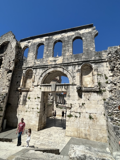 Ancient stone arch with blue sky.