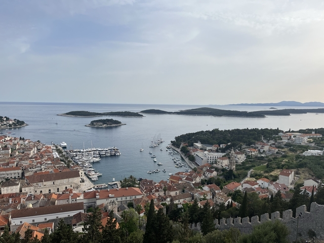 Aerial view of a coastal harbor with boats.