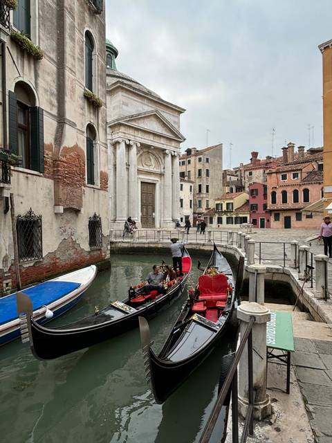 Gondola ride through a canal in Venice.
