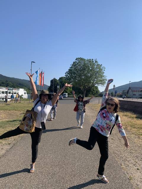 Group of women jumping and posing joyfully.