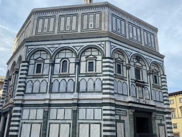 Baptistery of Florence with intricate marble facade.