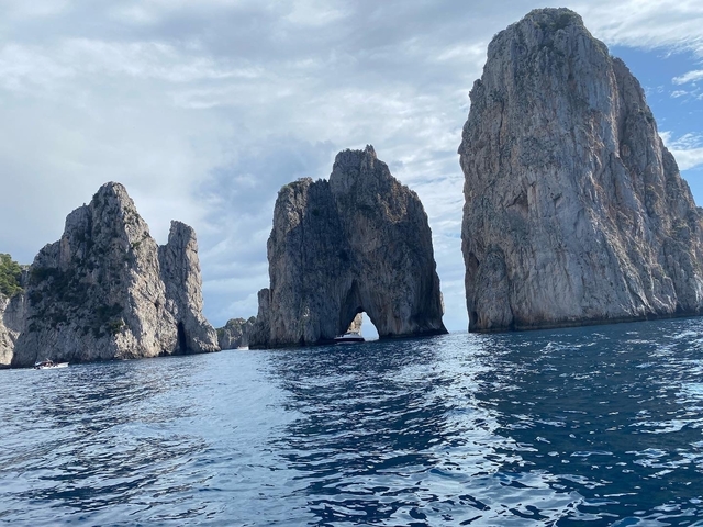 Dramatic cliffs and sea stacks in the ocean.