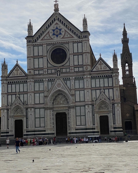 Facade of Basilica di Santa Croce with detailed arches.