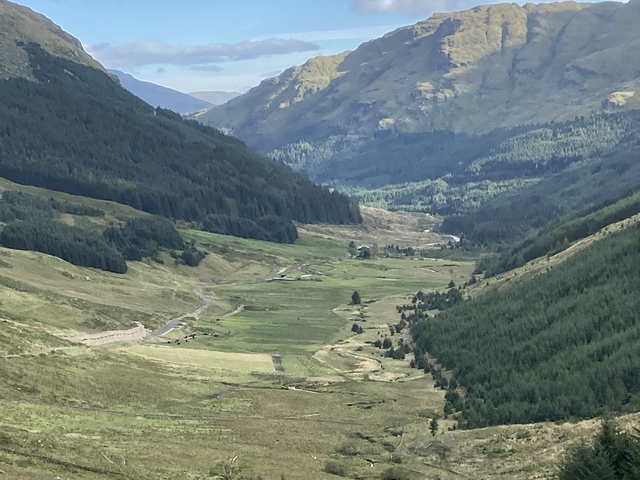 Valley with forest and winding river.