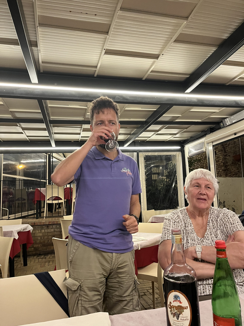 People enjoying drinks in a restaurant setting.