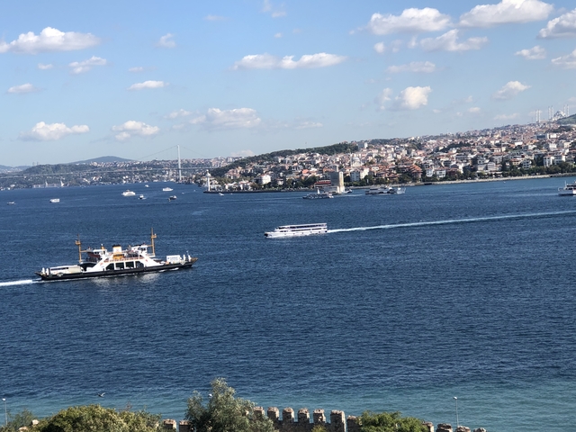 View of the Bosphorus with boats and city skyline.