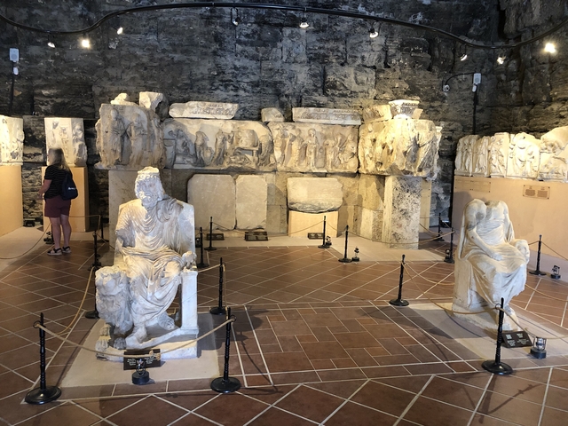 Indoor exhibit of ancient statues.