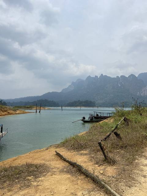 Scenic view of a lake with mountains in the background.