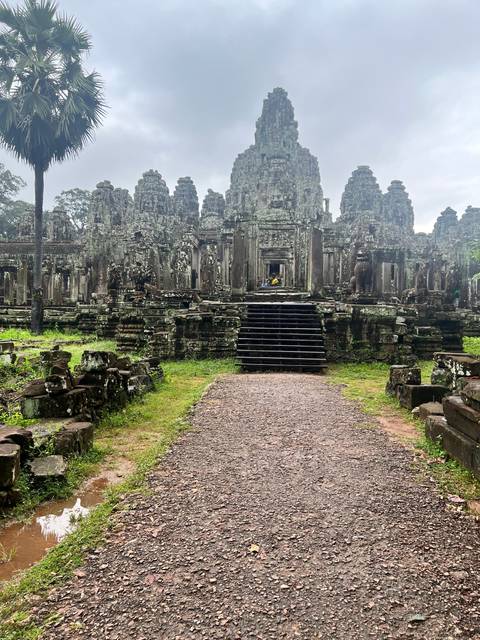 Intricate stone architecture surrounded by nature.