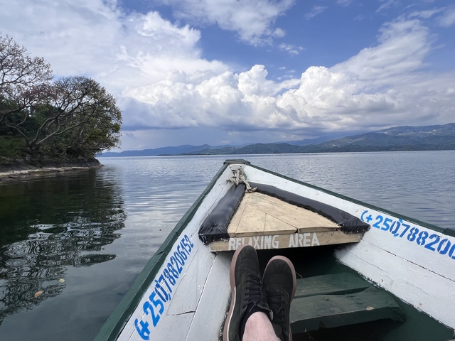 Relaxing boat ride with view of mountains and water.