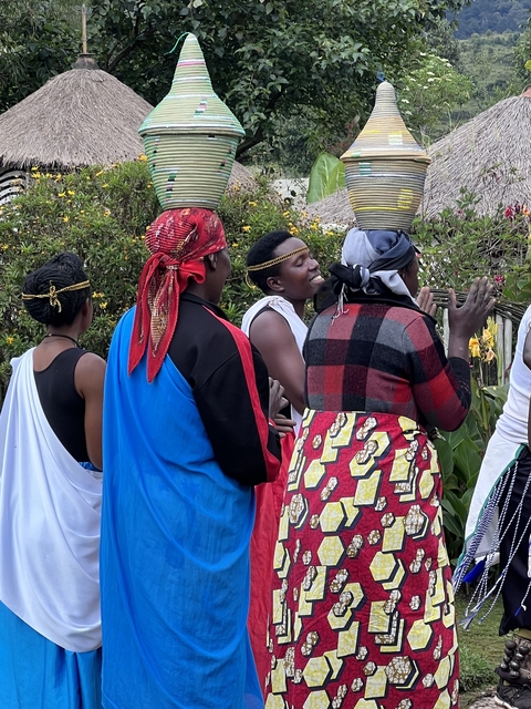 A group of people in traditional clothing engaged in cultural activity.