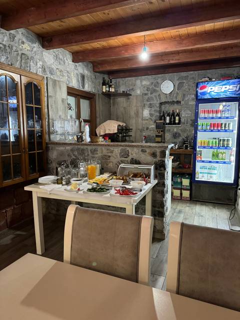 The interior of a rustic restaurant setup with a meal on the table.