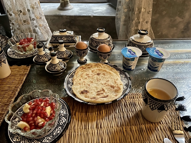 Traditional Moroccan breakfast setting with various food items.