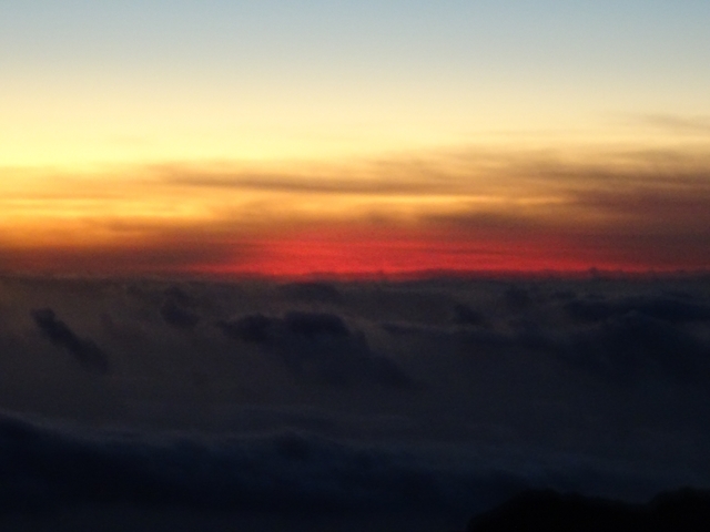 Blurred sunset view through the clouds.