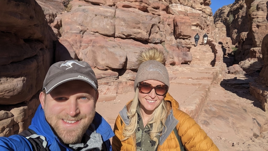 Couple in a rocky desert canyon.