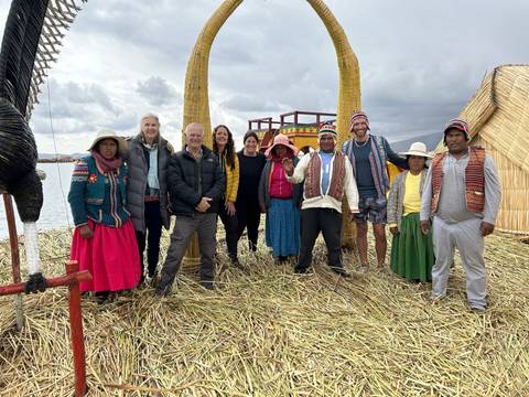 Group with locals on a reed island.