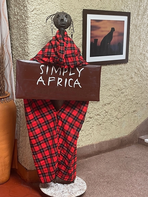 Decorative sign reading 'Simply Africa'.