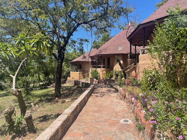 Lodge surrounded by greenery.