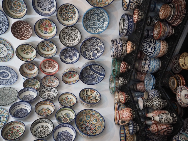 Collection of colorful, decorative bowls and pottery.
