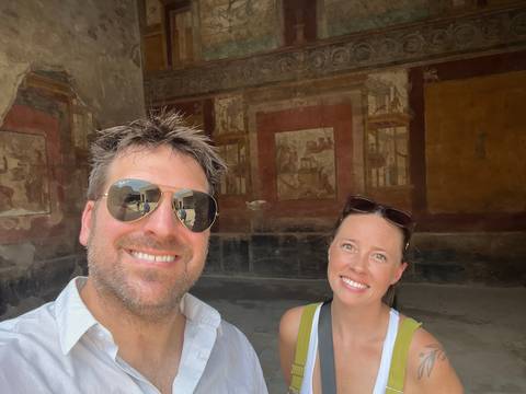 Upside-down photo of a couple inside a historic building.