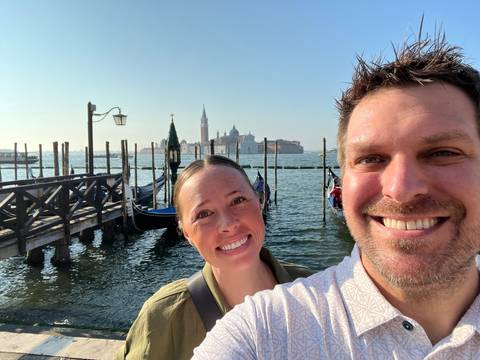 Upside-down photo of a couple near a waterfront.