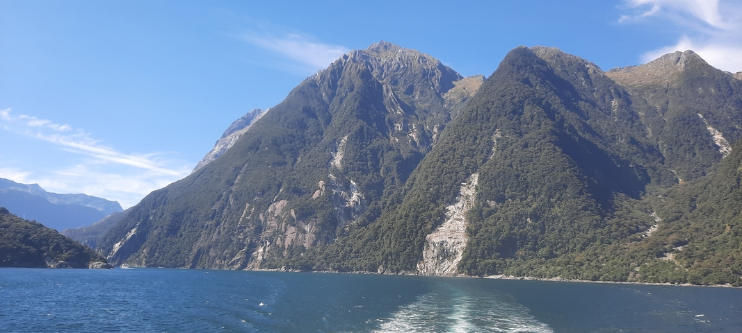 Majestic mountain scene from water with impressive peaks.