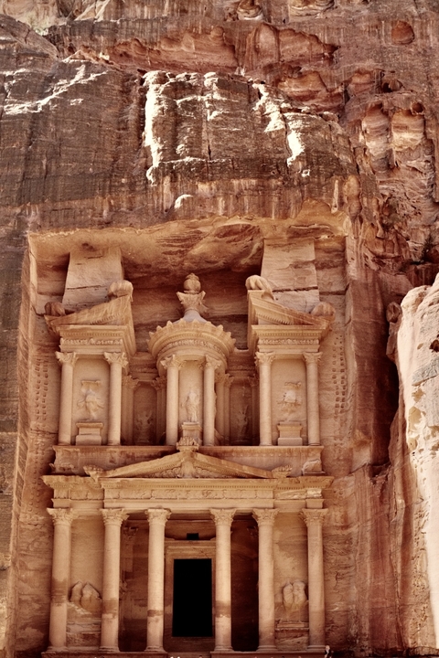 Carved stone facade of an ancient building.