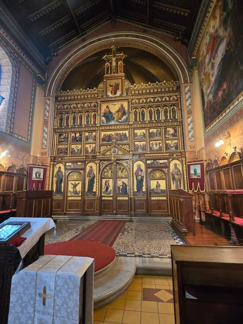 Interior of a church with ornate icons and decorations.