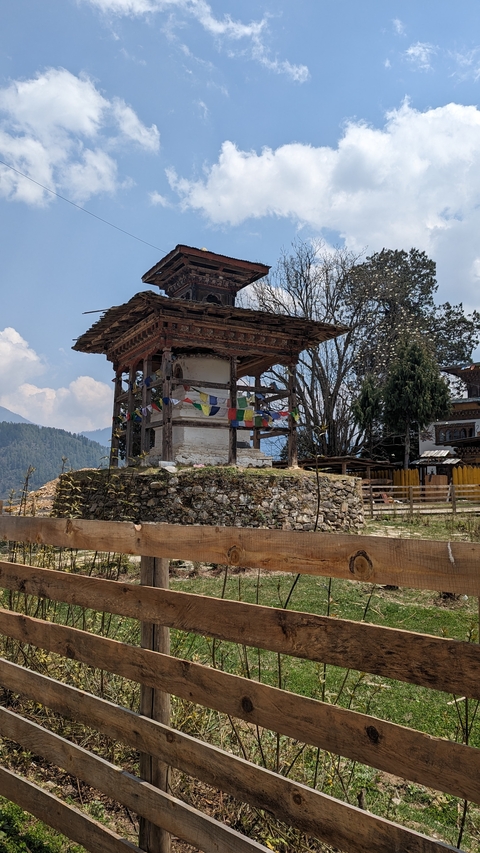 A small Bhutanese stupa adorned with prayer flags.