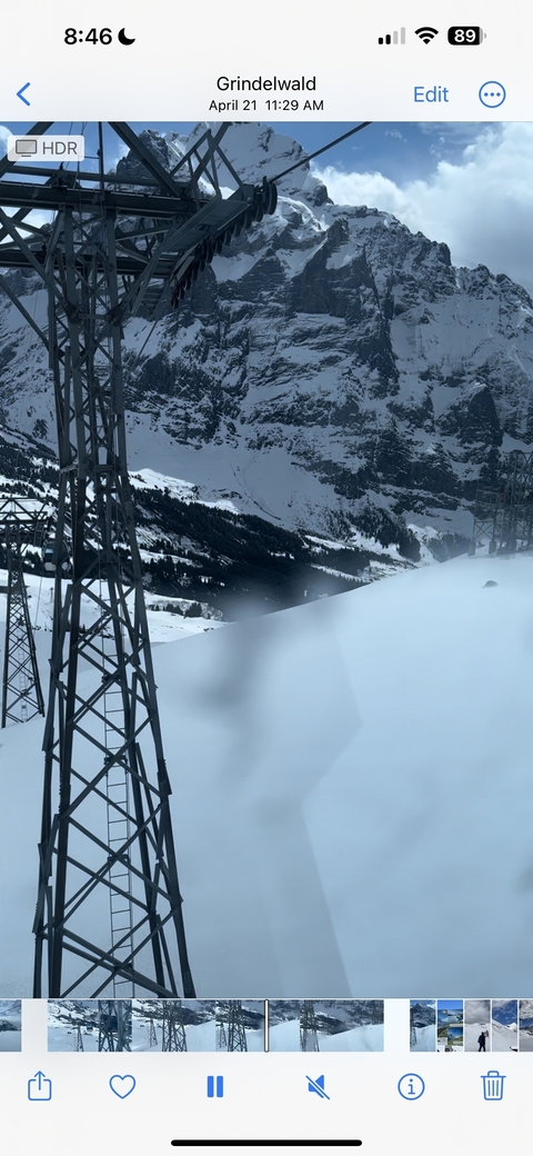 Snowy landscape with power lines.