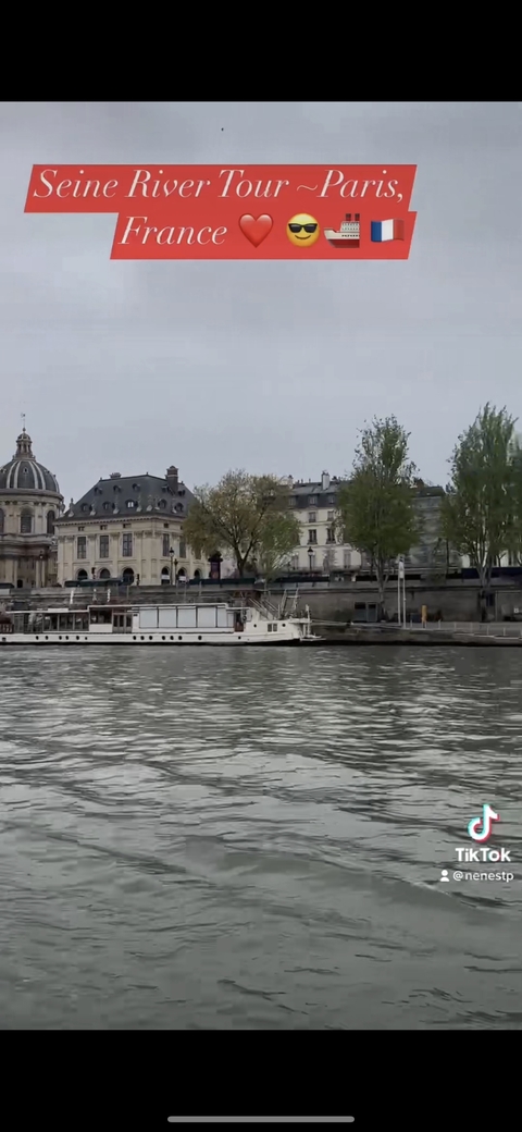 Riverside view with historical buildings.