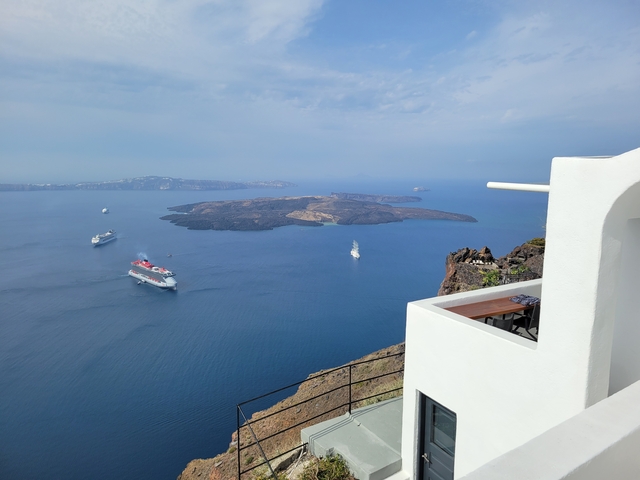 View of sea with volcanic islands and cruise ships