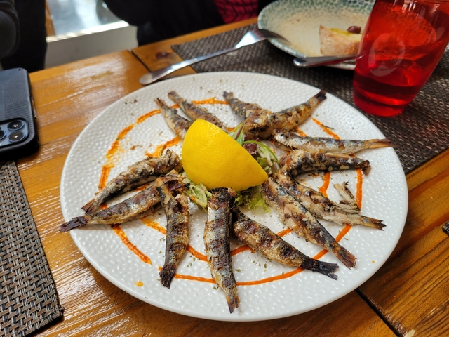 Plate of grilled fish with lemon